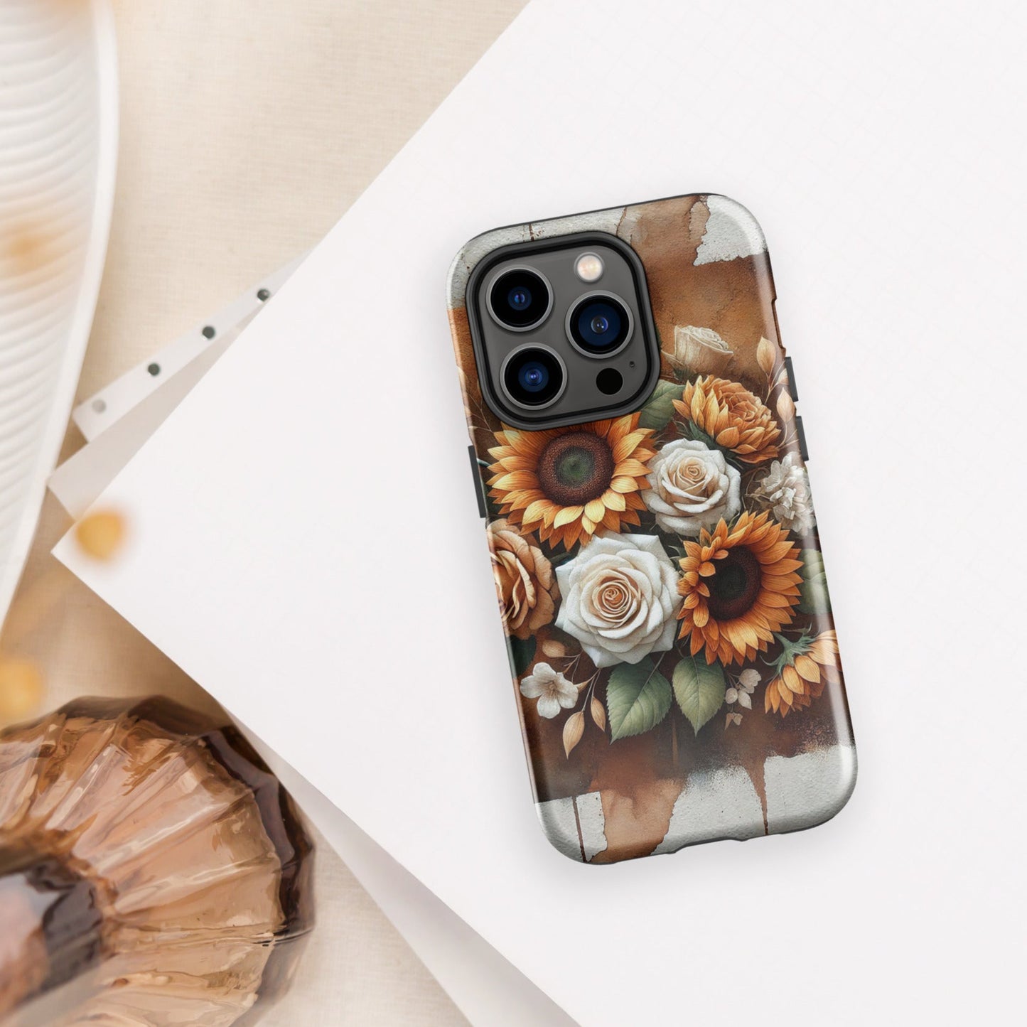 Front of iPhone 14 pro cover of beige and golden flower arrangement