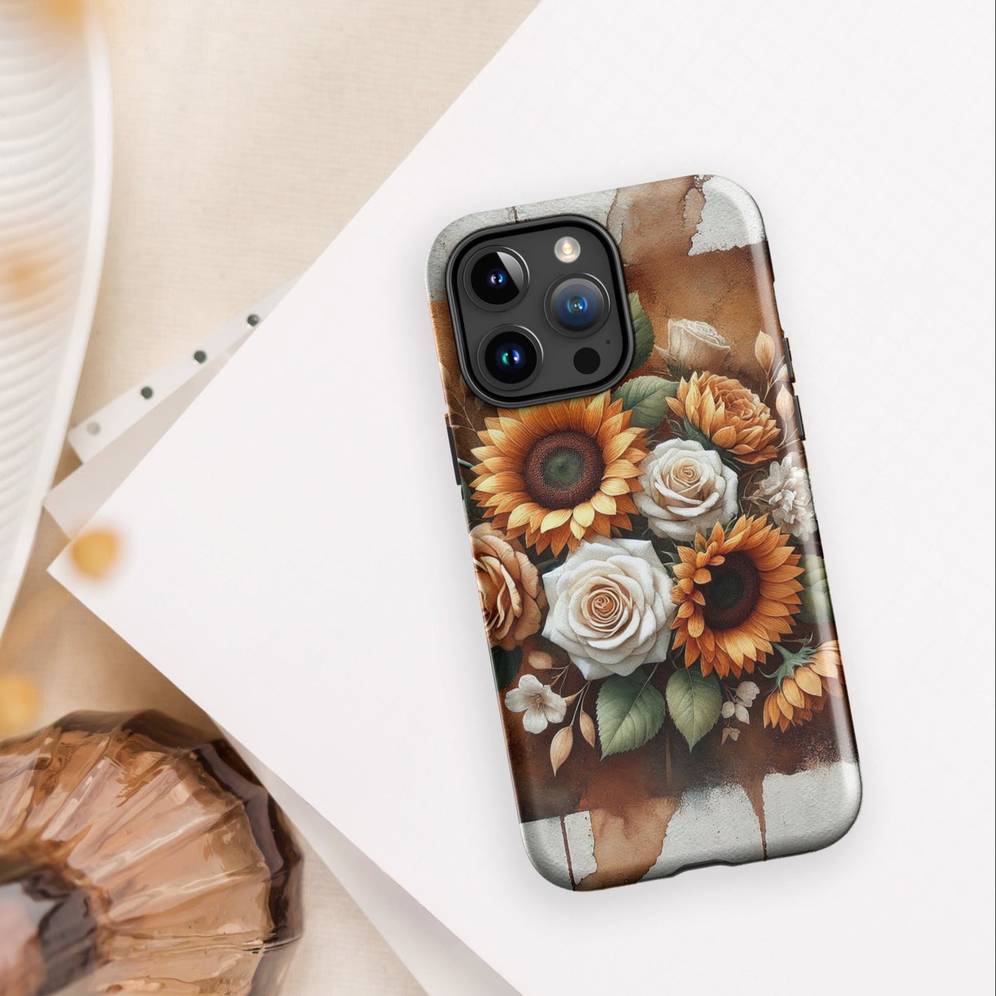 Front of iPhone 15 pro cover of beige and golden flower arrangement