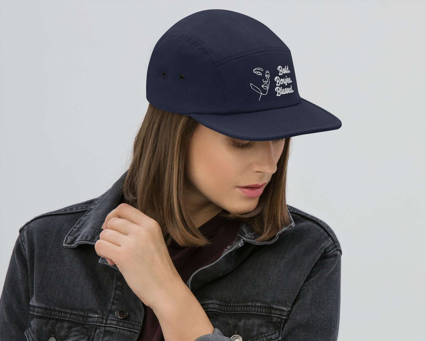 Right view of a navy five-panel cap with white text saying 'Bold, Boujee, Blessed'