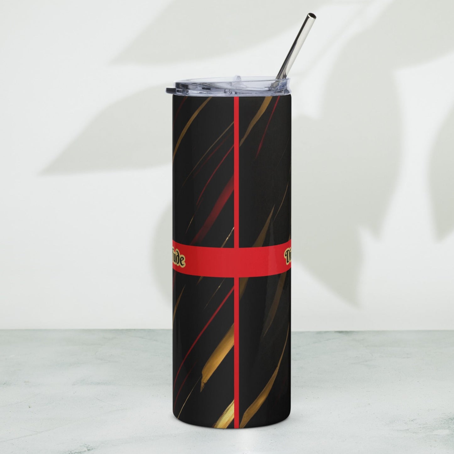 Back of a black stainless-steel tumbler with a red line and a black patterned background