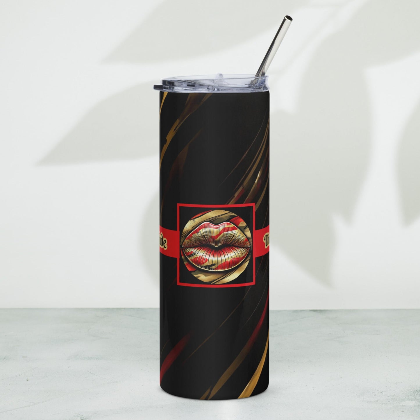 Front of a black stainless-steel tumbler with icon of gold, black, and red lips on black patterned background