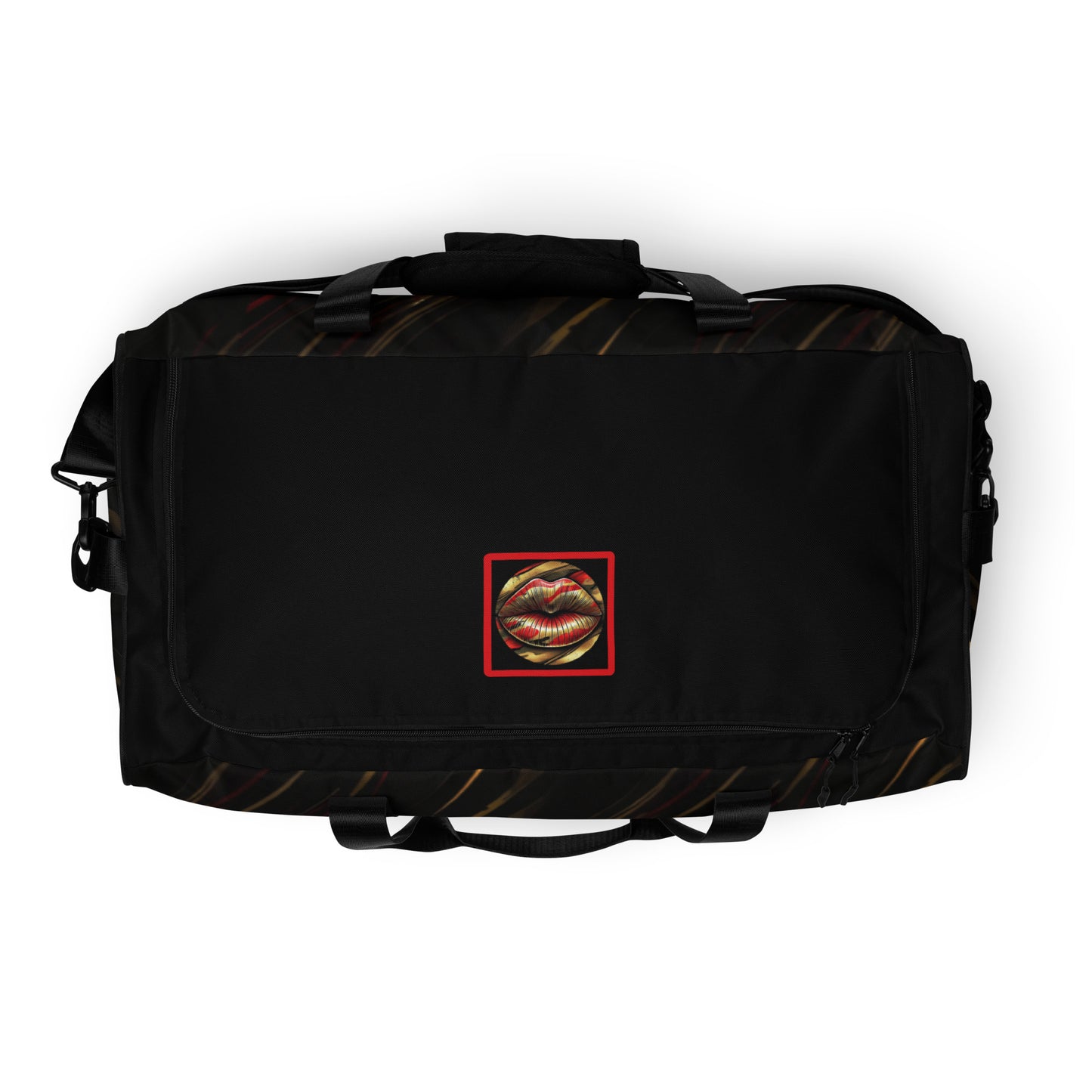 Top of a duffle bag with icon of gold, black, and red lips on black patterned background