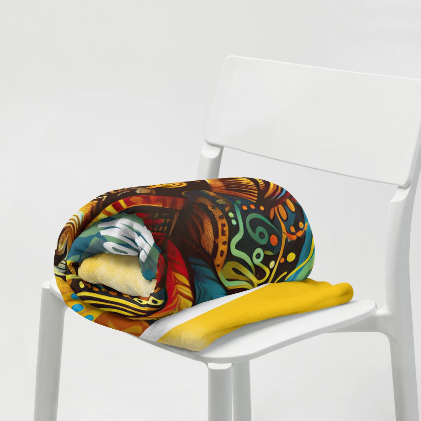 Tightly rolled fearfully, wonderfully made 50 x 60 throw in a white chair