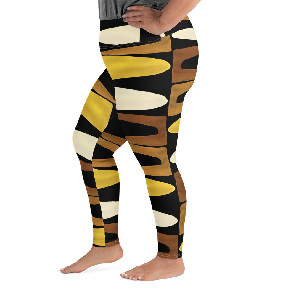 Left view of a woman wearing black, brown, beige and gold print leggings