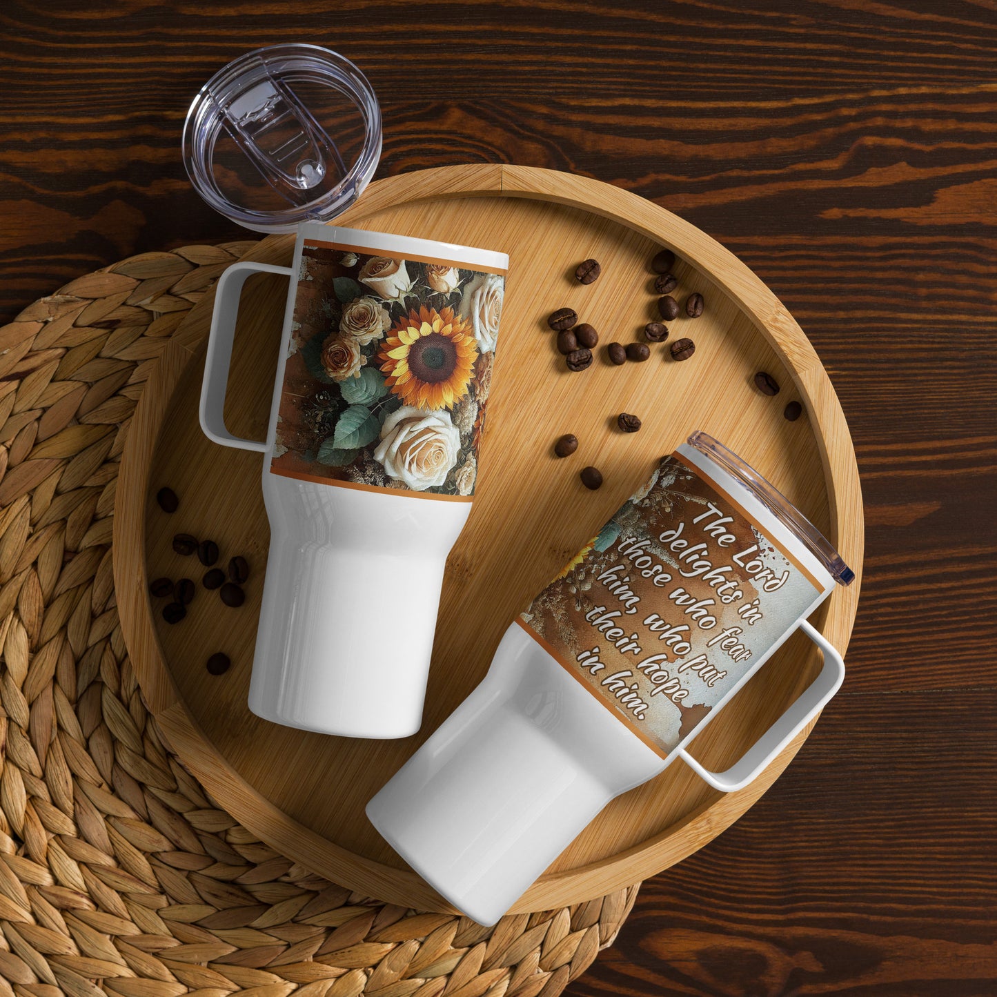 Two 25 oz travel mugs laying in a brown plate, let side showing brown, beige and orange flowers and right mug with Psalm 147:11: the LORD delights in those who fear him, who put their hope in his unfailing love.