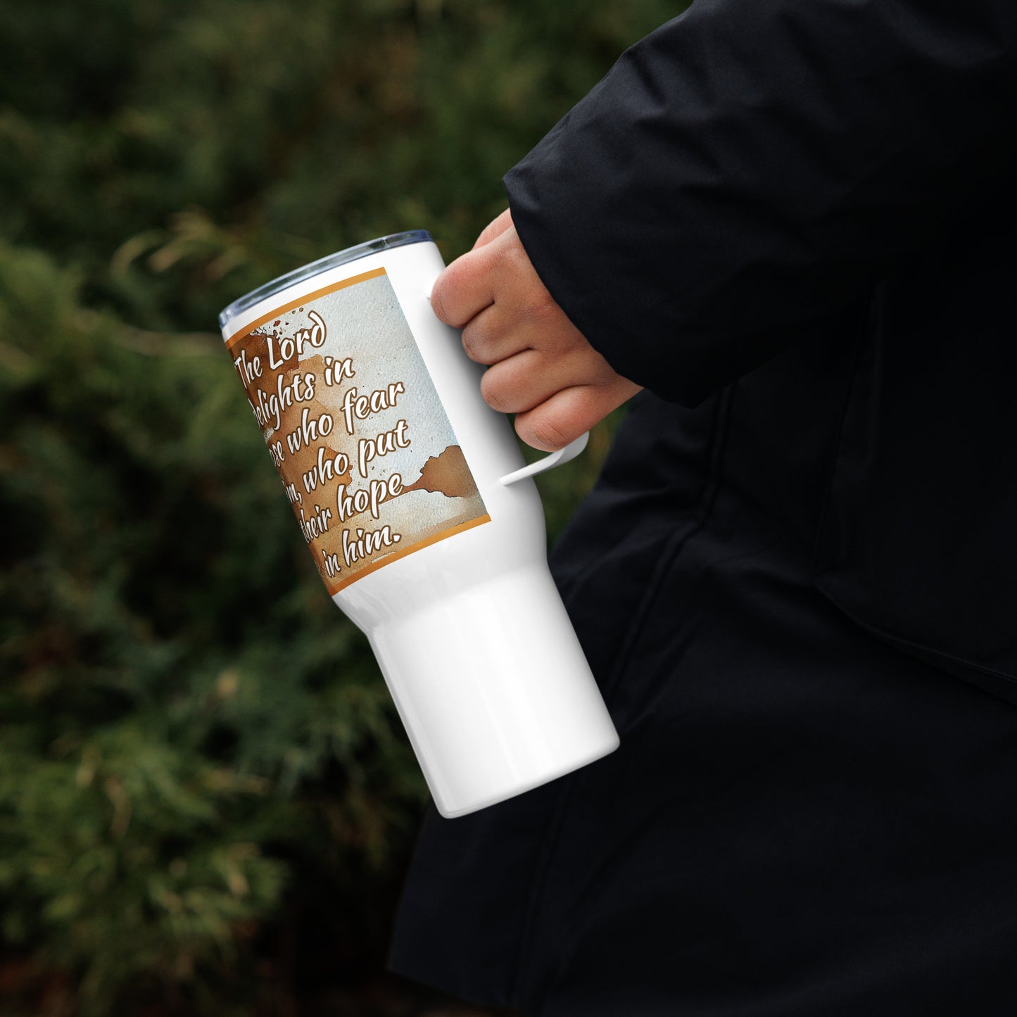 Left of 25 oz travel mug with brown, beige and orange flowers with Psalm 147:11: the LORD delights in those who fear him, who put their hope in his unfailing love.