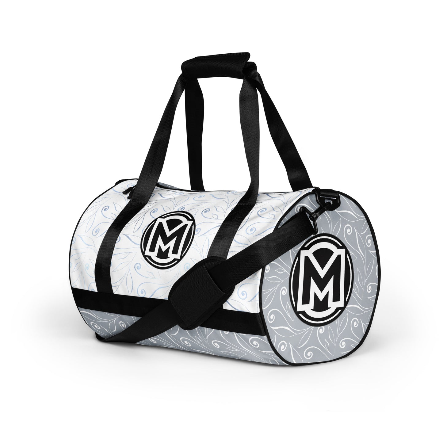 Left front of light blue gym bag with blue swirl background and 'M' logos