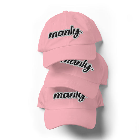 Front of pink dad hat with the 'Manly" text logo