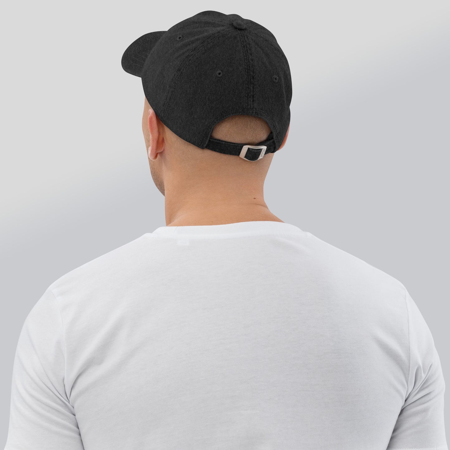 Back of black cotton hat with buckle closure