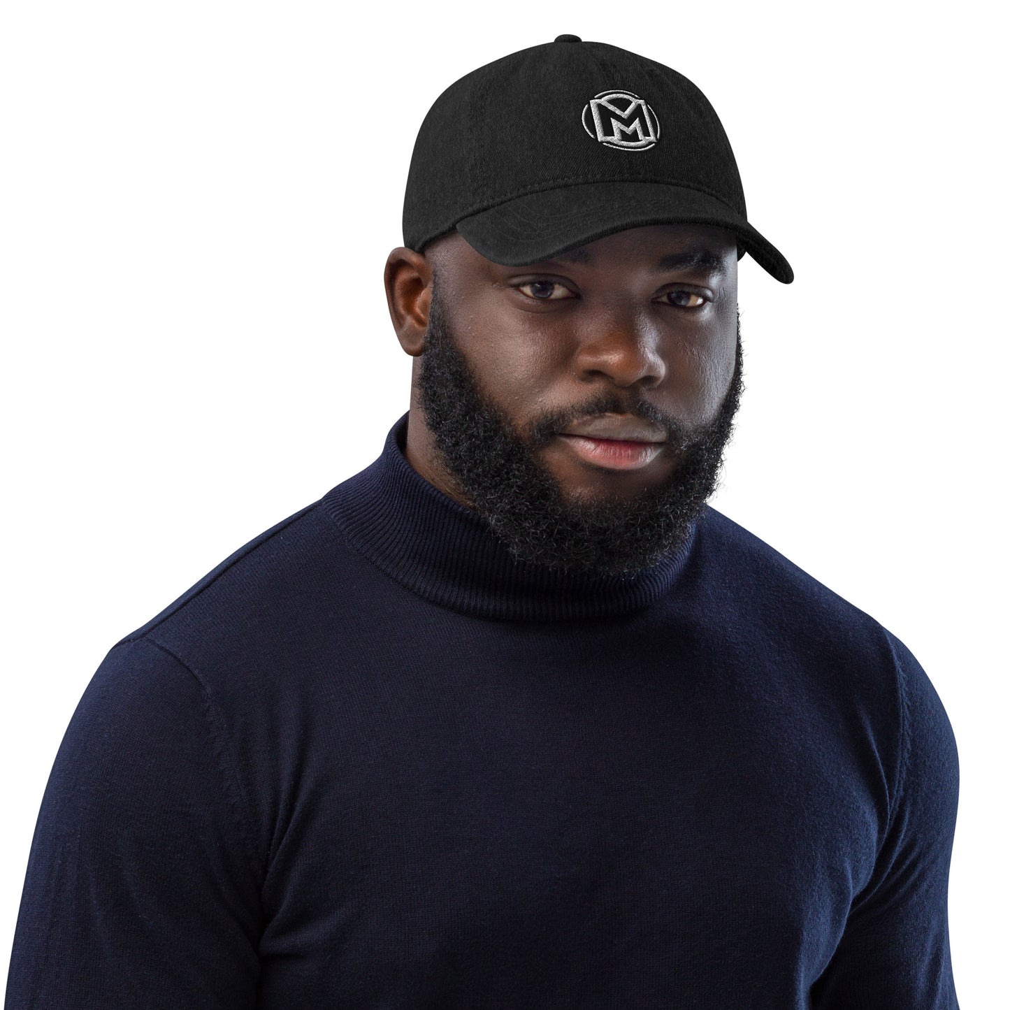 Front of black cotton hat with manly 'M' embroidered across the front