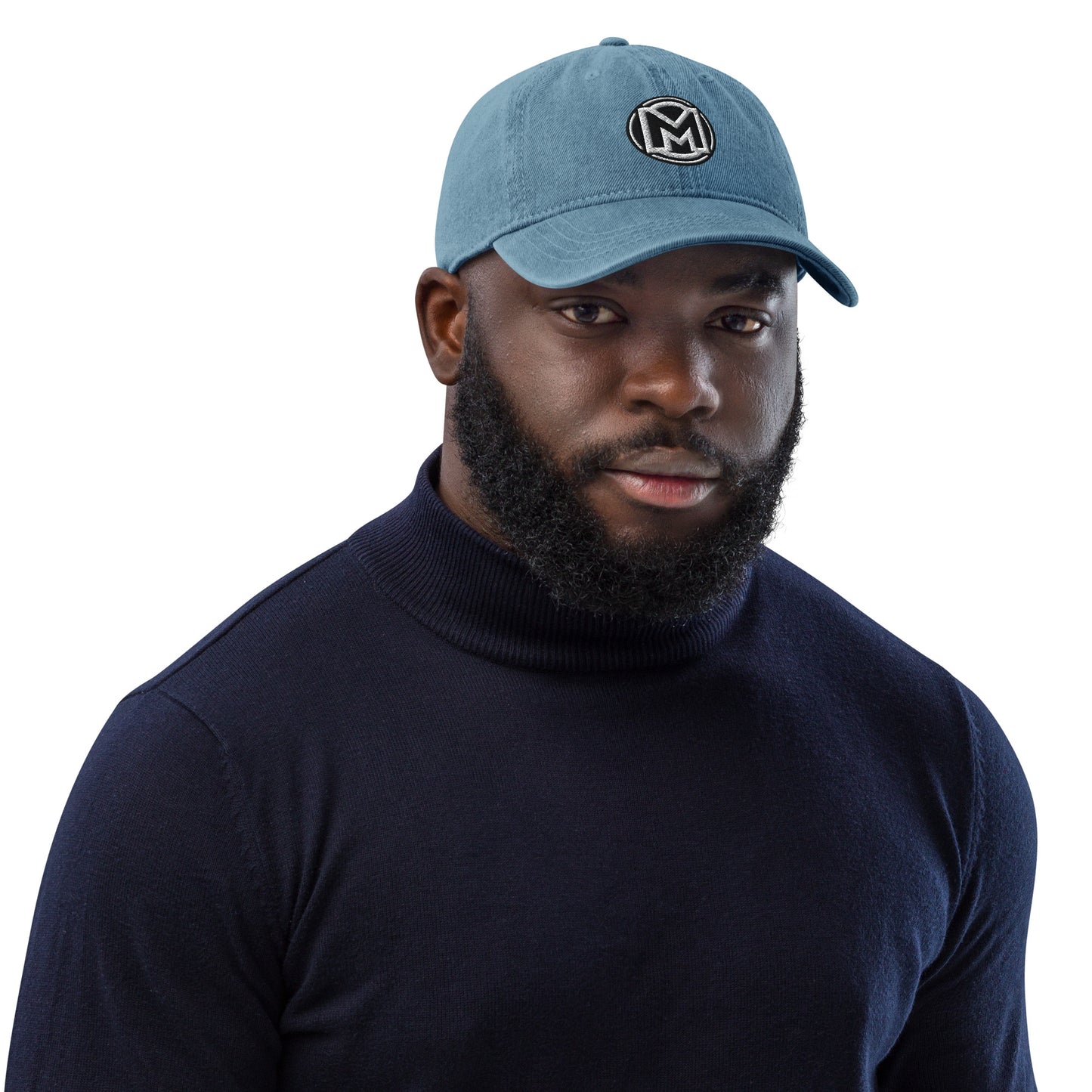 Front of blue cotton hat with manly 'M' embroidered across the front
