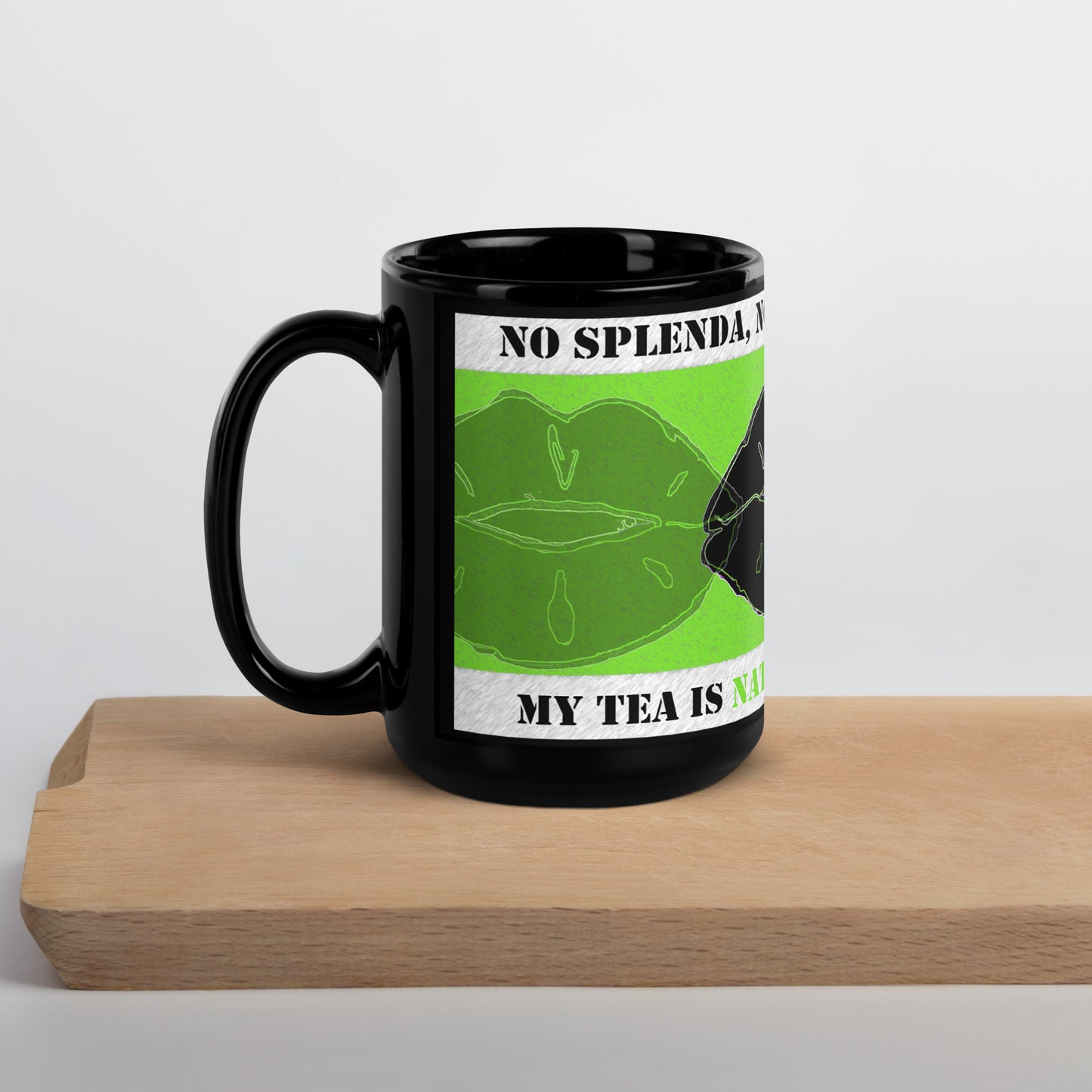 Left view of black mug with green lips and black lips on green and text saying 'no Splenda, no sugar, no honey on top white banner, text saying "my tea is naturally sweetened