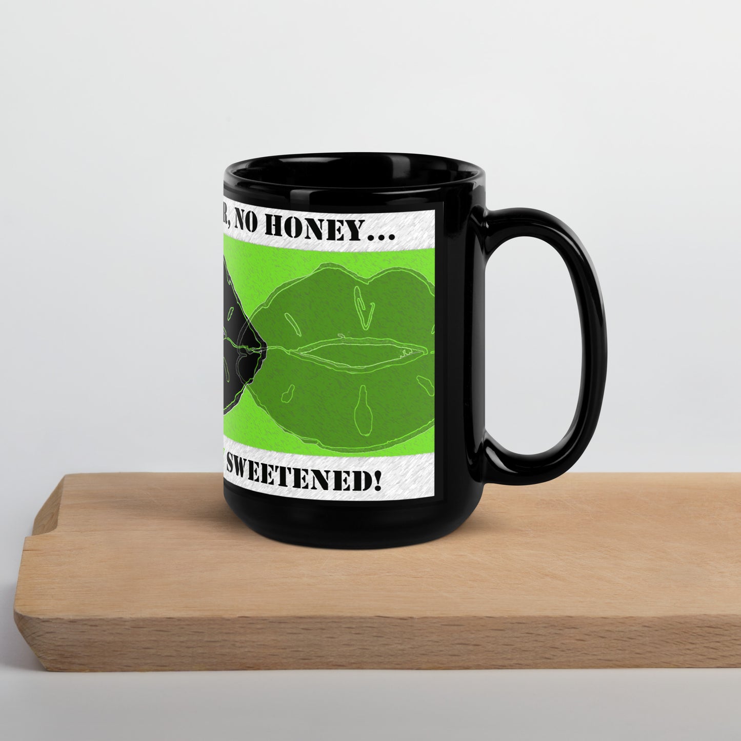 Right view of black mug with green lips and black lips on green and text saying 'no Splenda, no sugar, no honey on top white banner, text saying "my tea is naturally sweetened