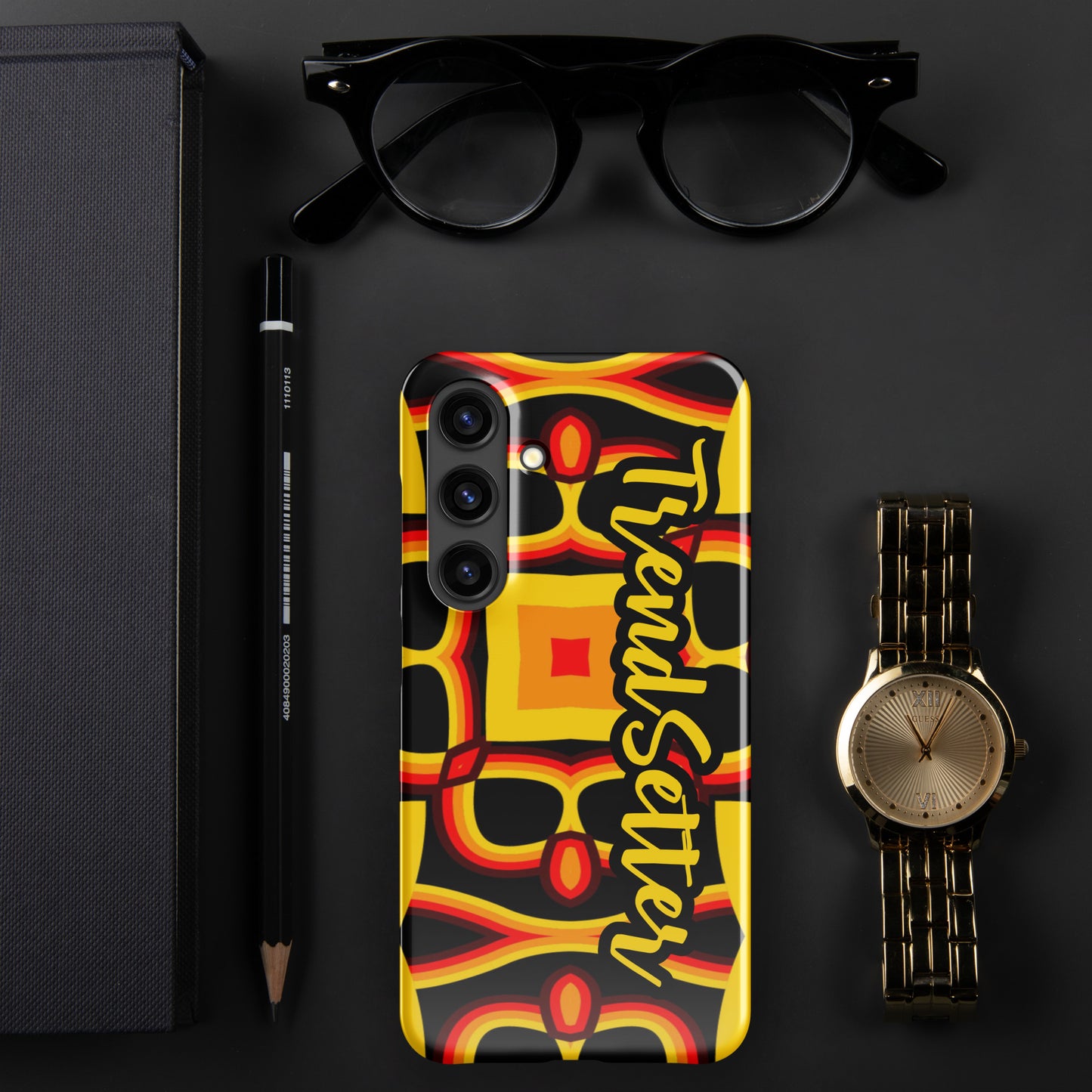 Front of gold, yellow, red and black print Samsung s24 glossy case with text "TrendSetter' in black and gold