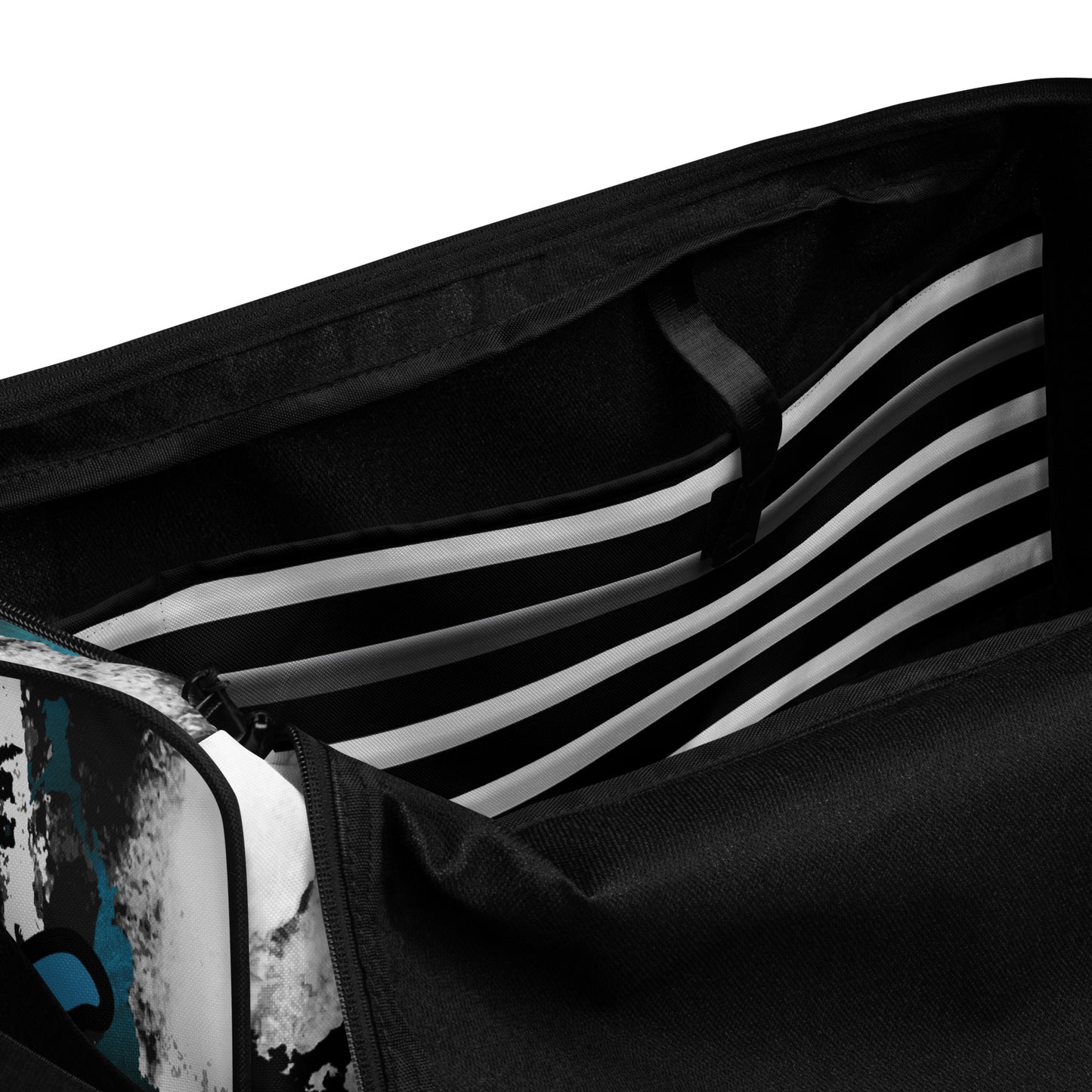 Inside pocket of Black, white and blue stripped and patterned duffel