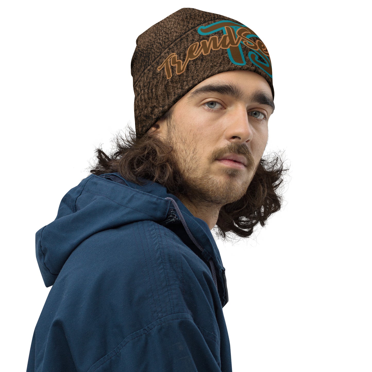 Right front of Brown Leather Print beanie with top teal text saying 'TS' and bottom bronze text saying