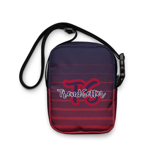 Back of TrendSetter Utility Crossbody Bag with red and blue stripped design and with TS-TrendSetter logo