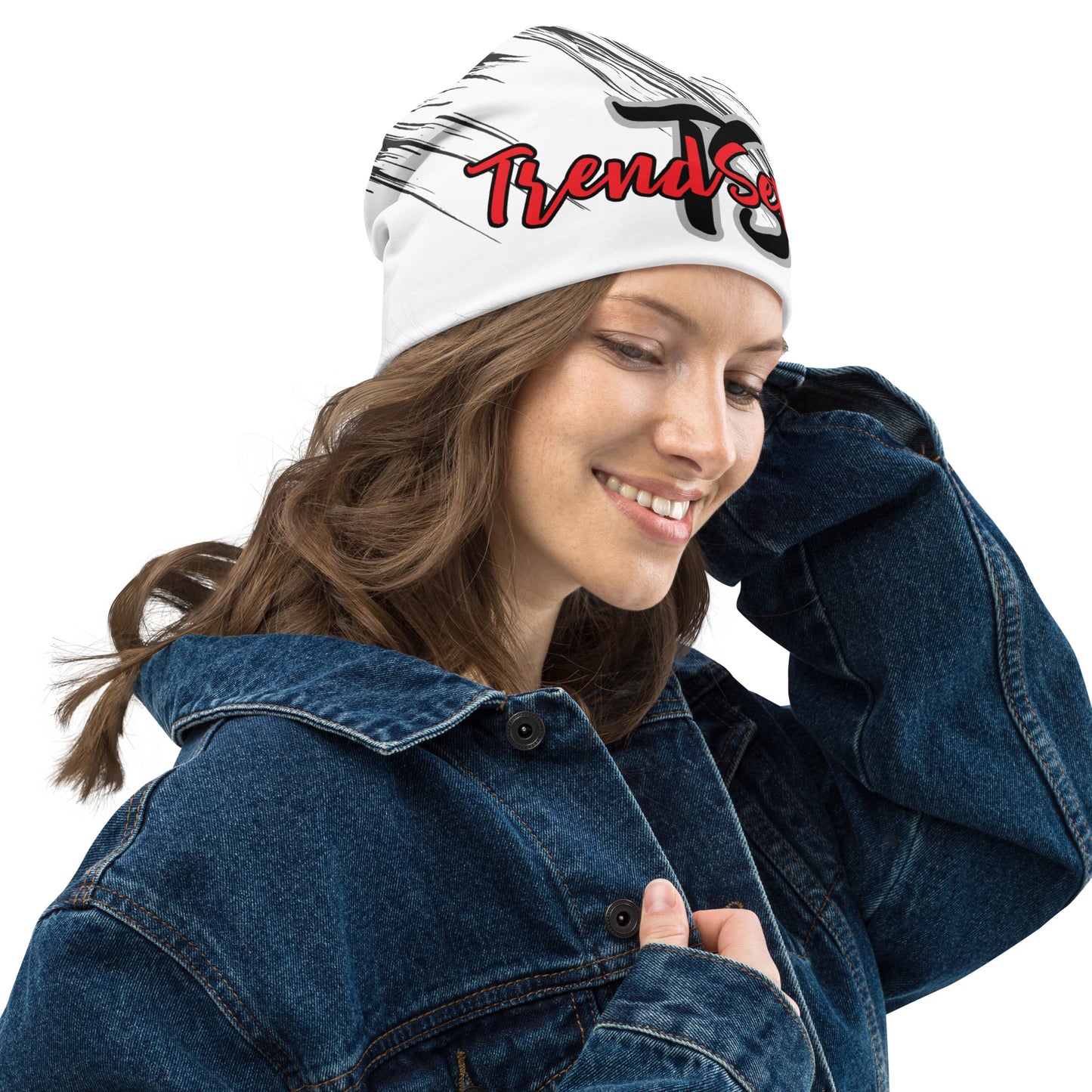 Right front of black and white beanie with black and gray text saying 'TS' and red and black text saying