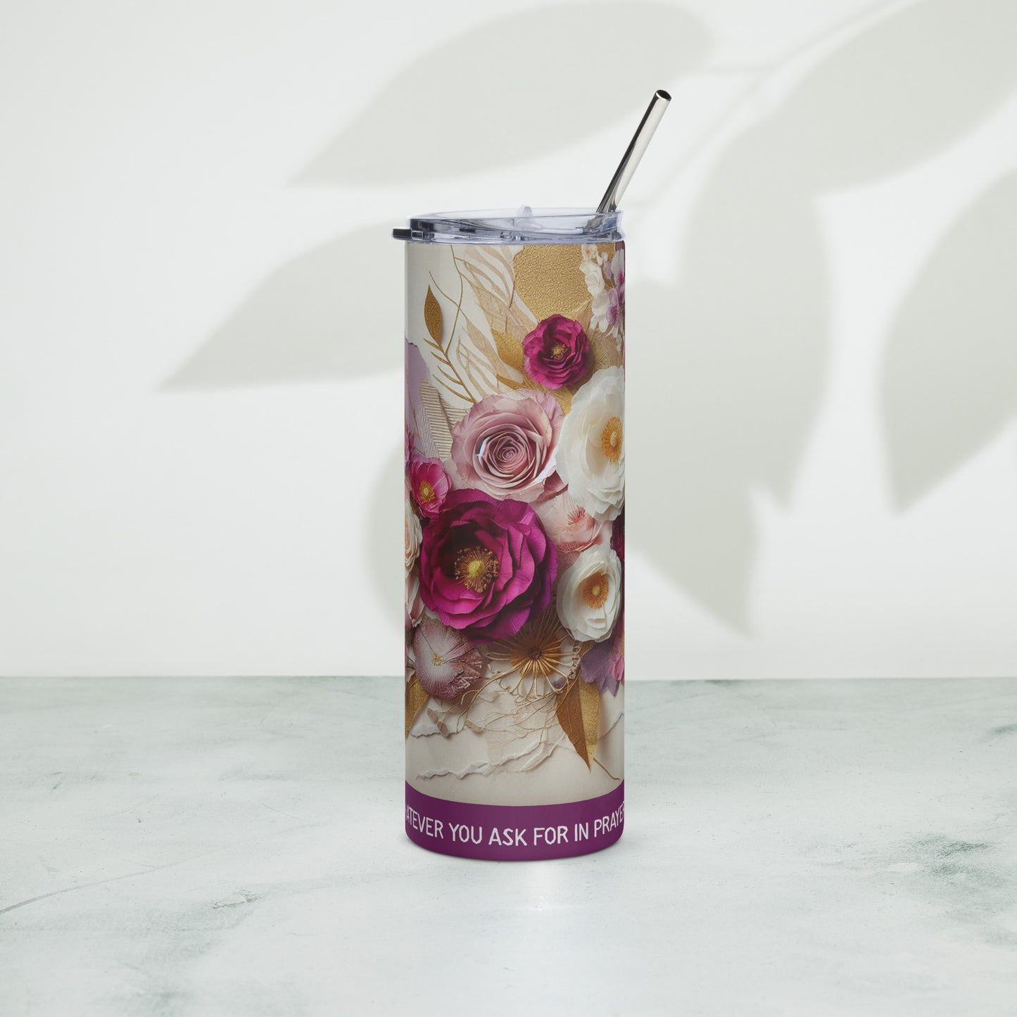 Left of purple and white floral tumbler with text across bottom of tumbler saying ' If you believe, you will receive whatever you ask for in prayer'
