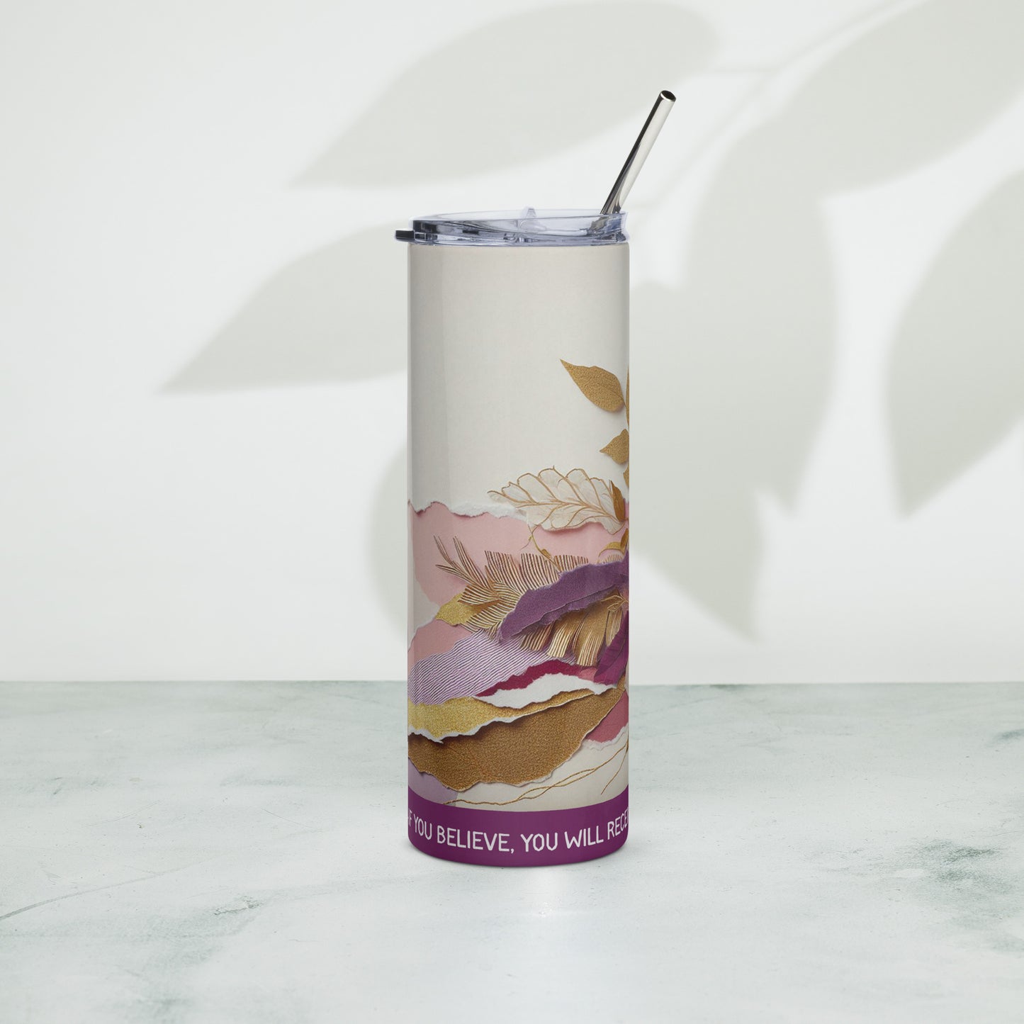 Right of purple and white floral tumbler with text across bottom of tumbler saying ' If you believe, you will receive whatever you ask for in prayer'