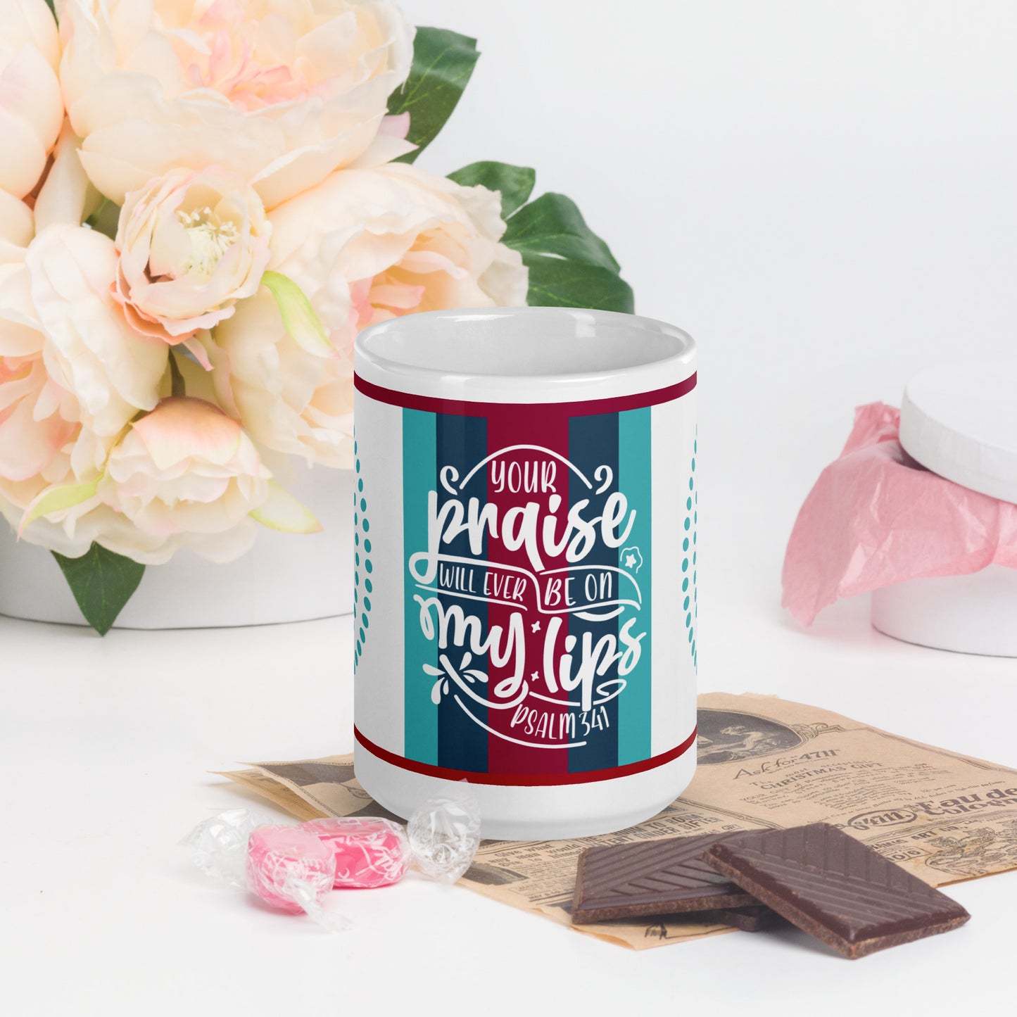 Front of 15 oz white glossy mug with blue and burgundy striped background and white text saying 'your praise' from Psalm 34