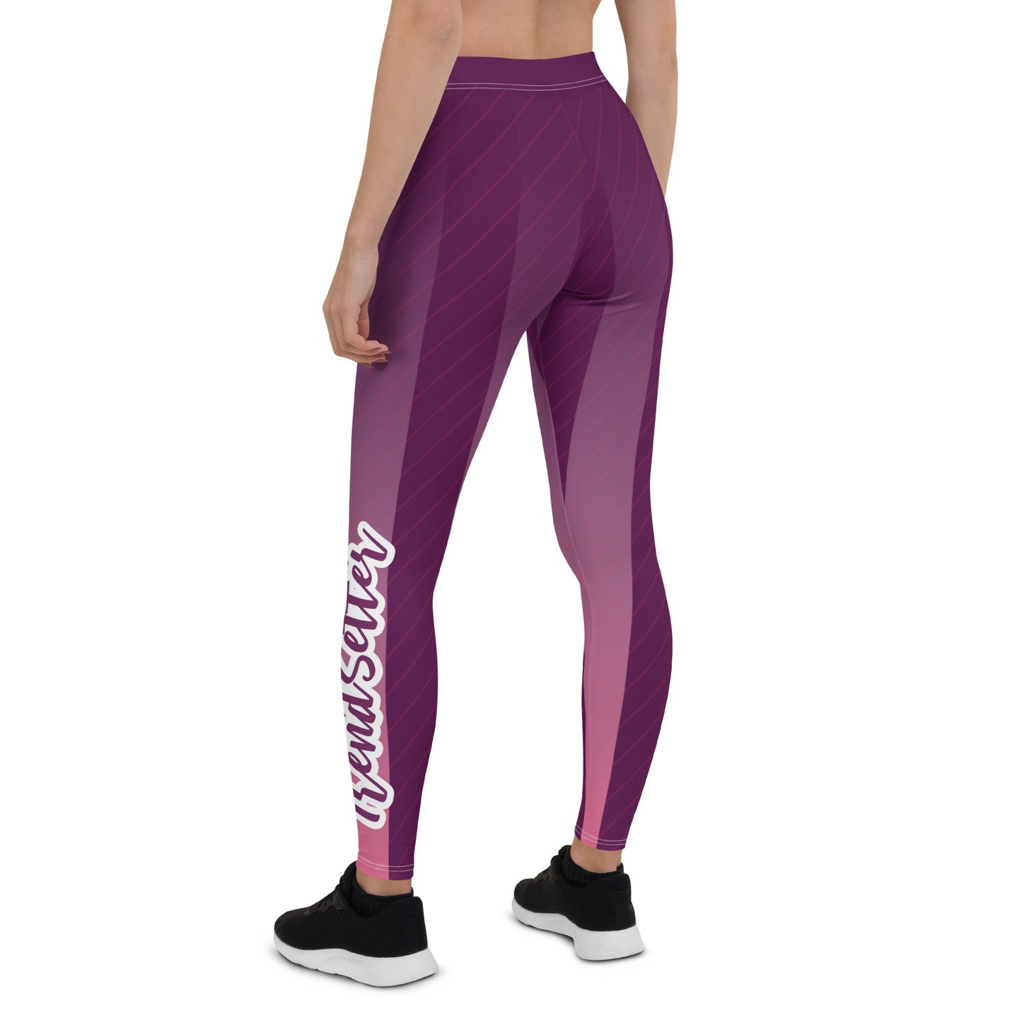 Back of purple and white lined leggings with purple and white text saying 'TrendSetter' on left calf