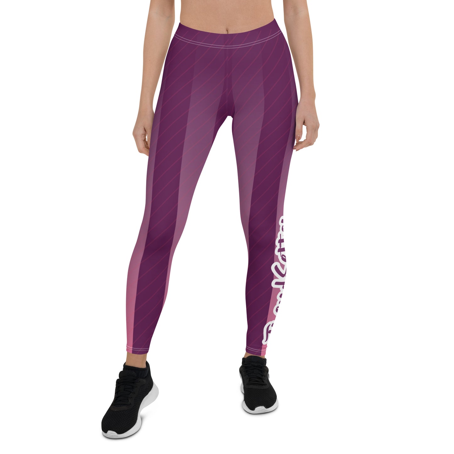 Front of purple and white lined leggings with purple and white text saying 'TrendSetter' on left calf