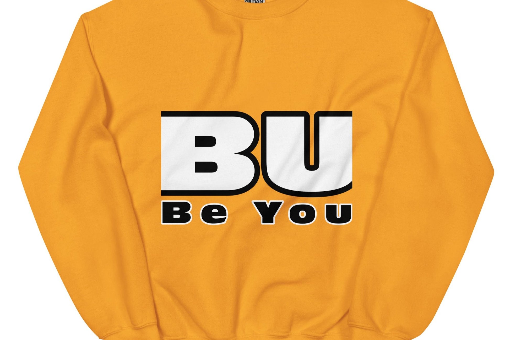 Front of gold sweatshirt with black and white text saying 'BU' and black text saying 'be you'