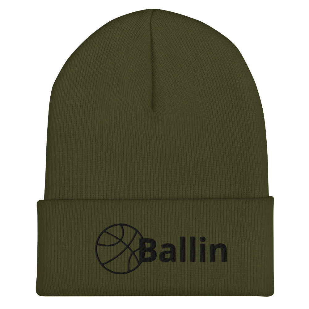 Front of olive cuffed beanie with black logo of basketball and word saying 'ballin'