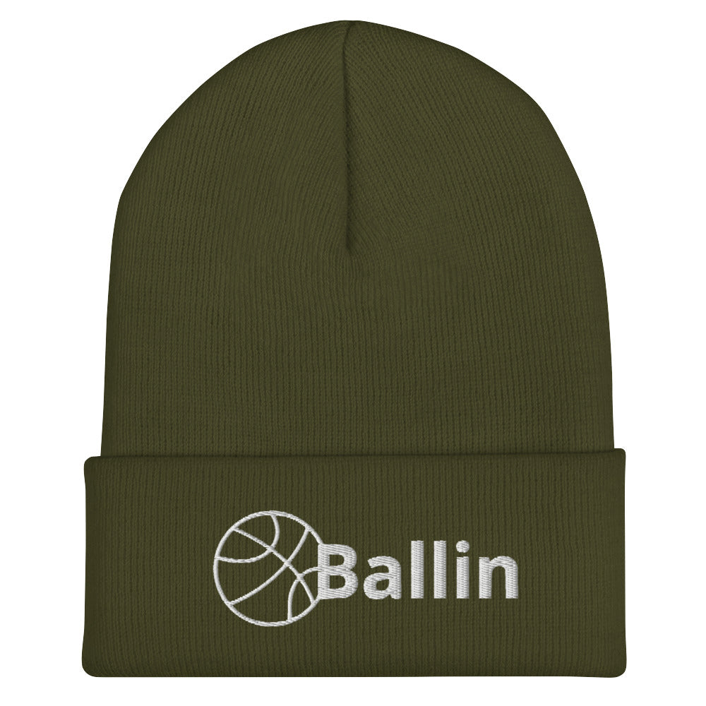 Front of olive cuffed beanie with white logo of basketball and word saying 'ballin'