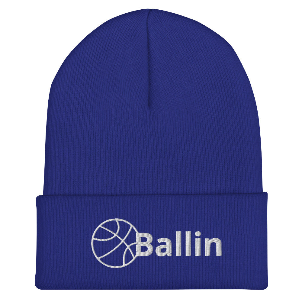 Front of royal cuffed beanie with white logo of basketball and word saying 'ballin'