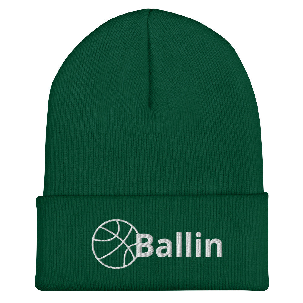 Front of spruce cuffed beanie with white logo of basketball and word saying 'ballin'