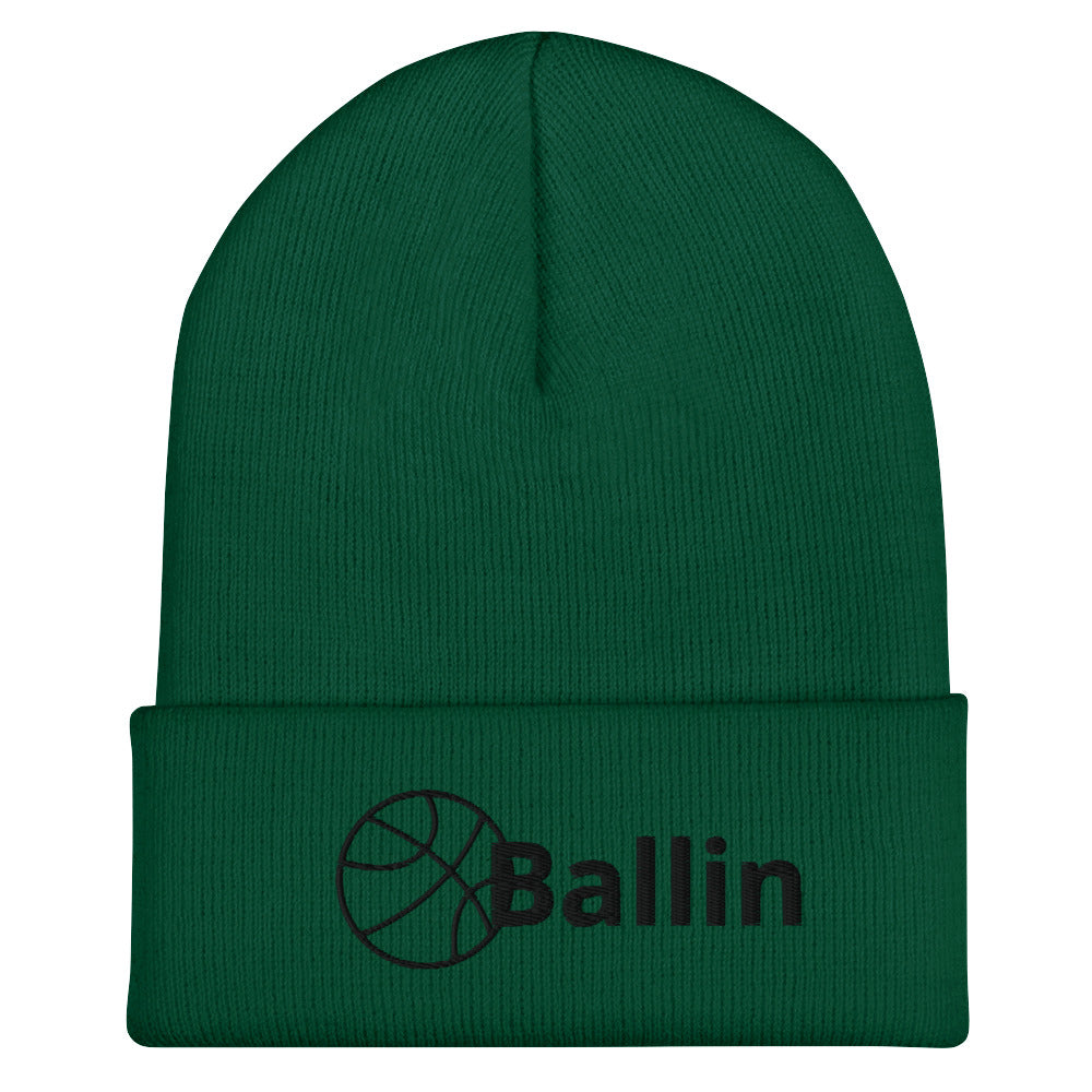 Front of spruce cuffed beanie with black logo of basketball and word saying 'ballin'