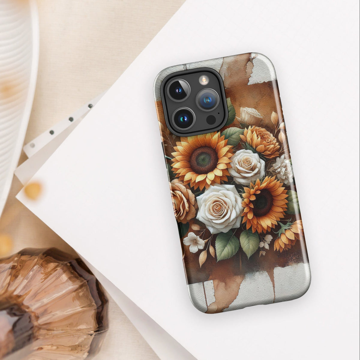 Front of iPhone 16 pro maxcover of beige and golden flower arrangement