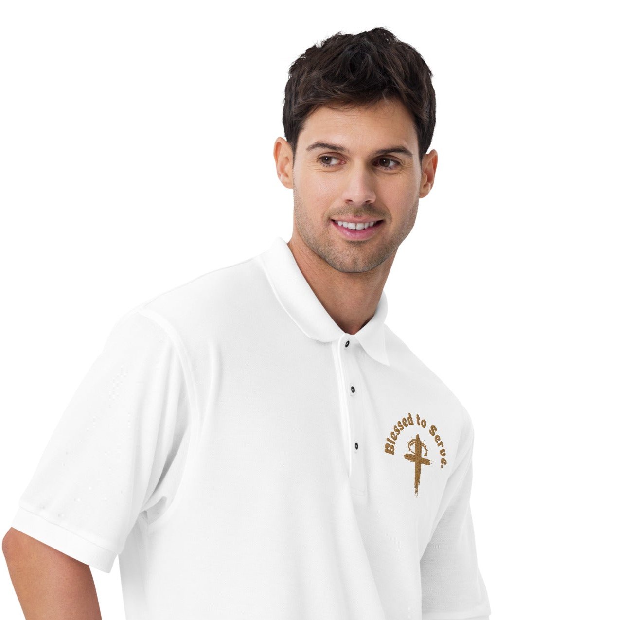 Right front zoomed-of white polo with tan cross and tan text saying 'blessed to serve'