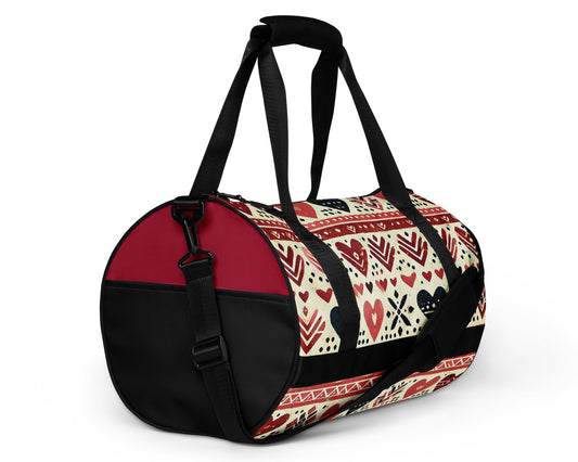 Right ront of burgundy and pink hearts patterned gym bag