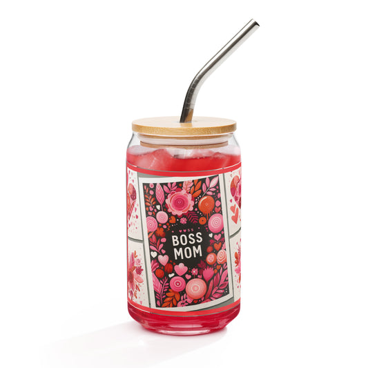 Front view of glassware with lid and straw and image of words 'boss mom' in white surrounded by black and flowers of pink and orange and hearts of pinks on a white background on left and right sides.