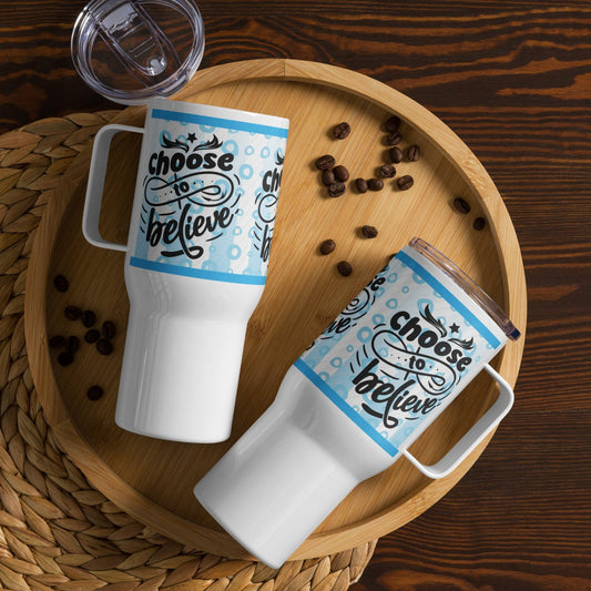 Left and side views of a 25 oz blue and white travel mug with a handle and with text saying 'choose to believe'