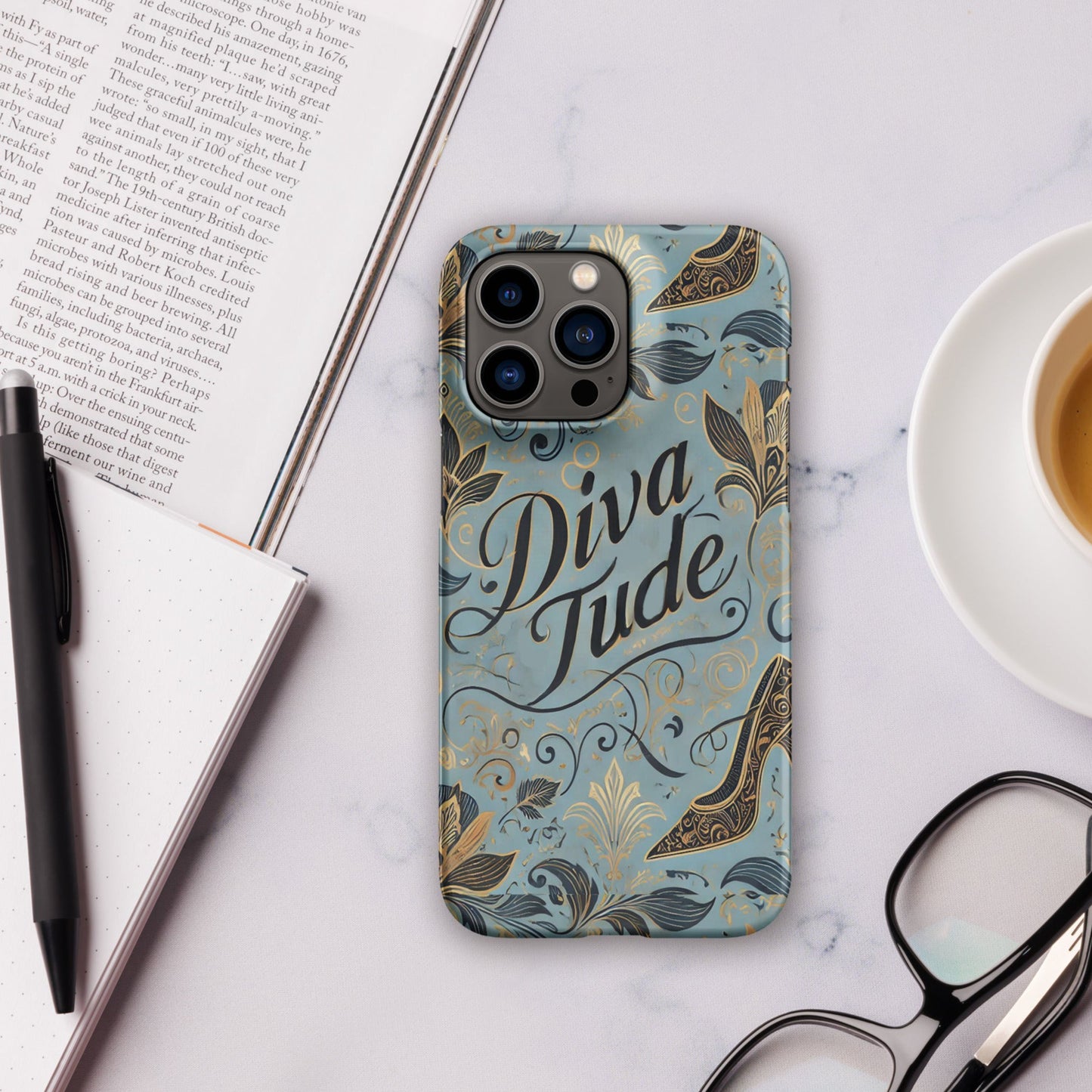 Front of blue pattern iPhone 14 pro case with text saying 'DivaTude'