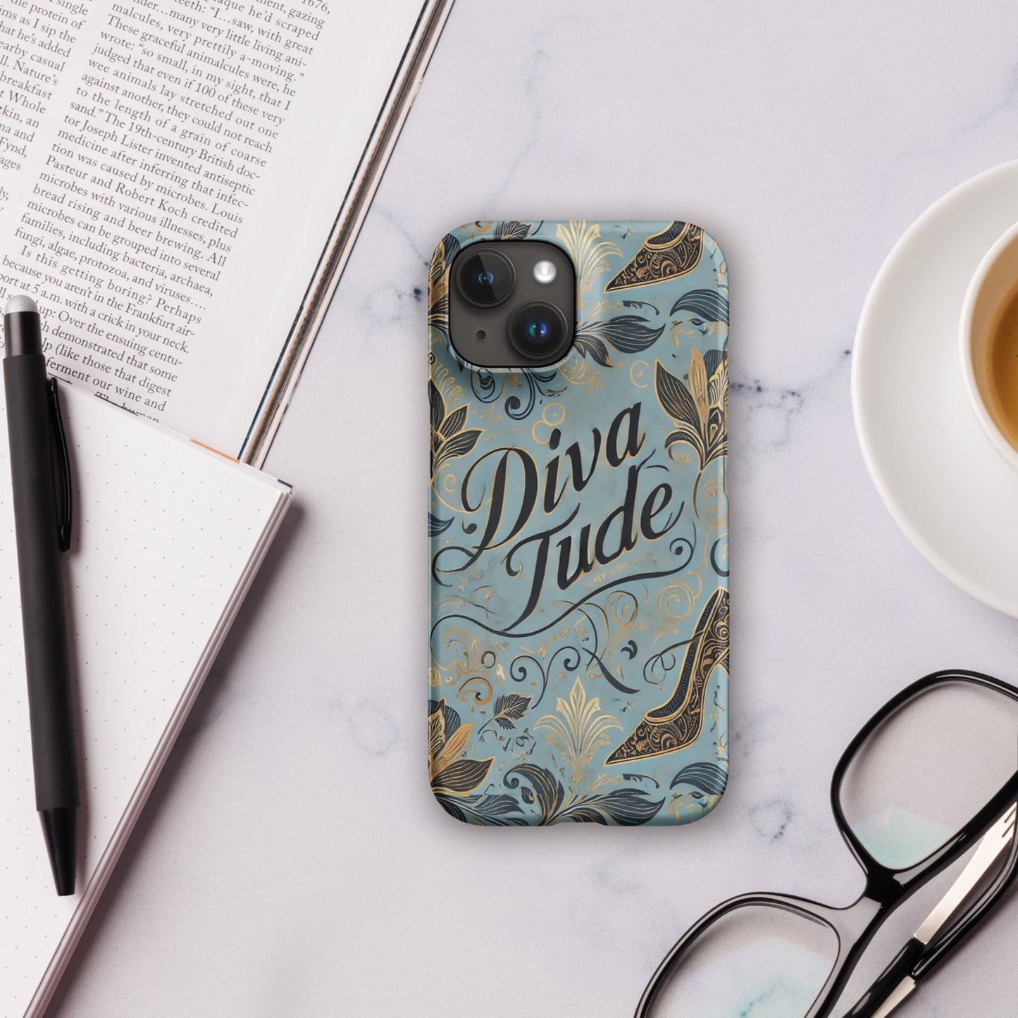 Front of blue pattern iPhone 15 case with text saying 'DivaTude'
