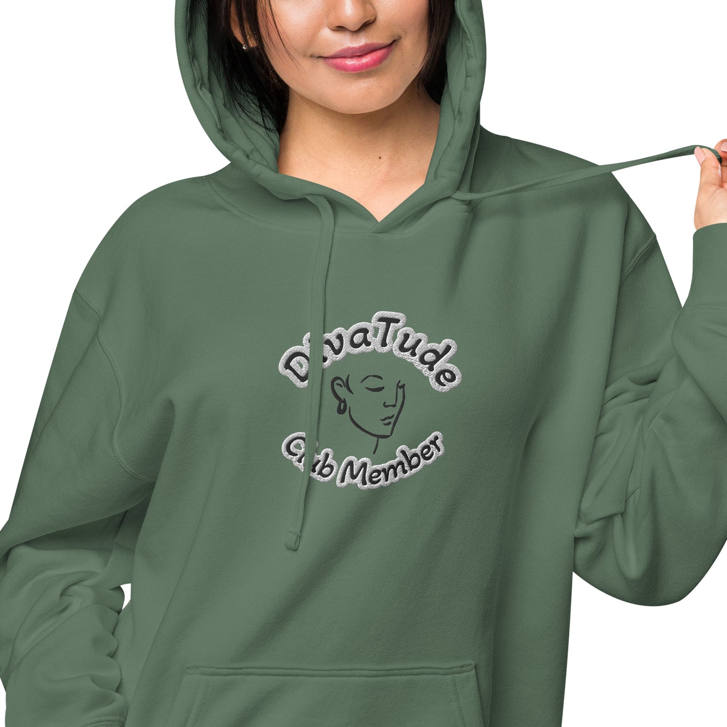 Front of green hoodie with embroidered image of woman's face and text reading 'DivaTude' above and 'Club Member