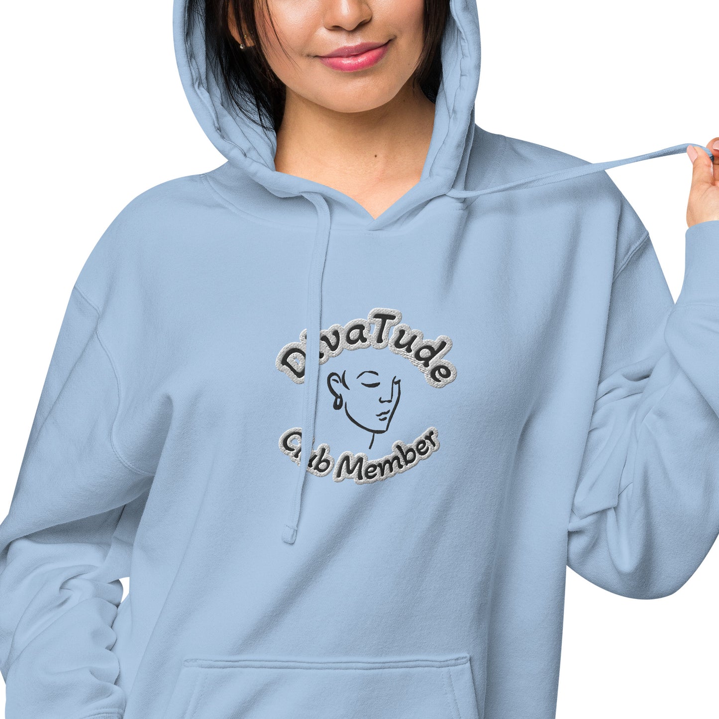 Front of light blue hoodie with embroidered image of woman's face and text reading 'DivaTude' above and 'Club Member