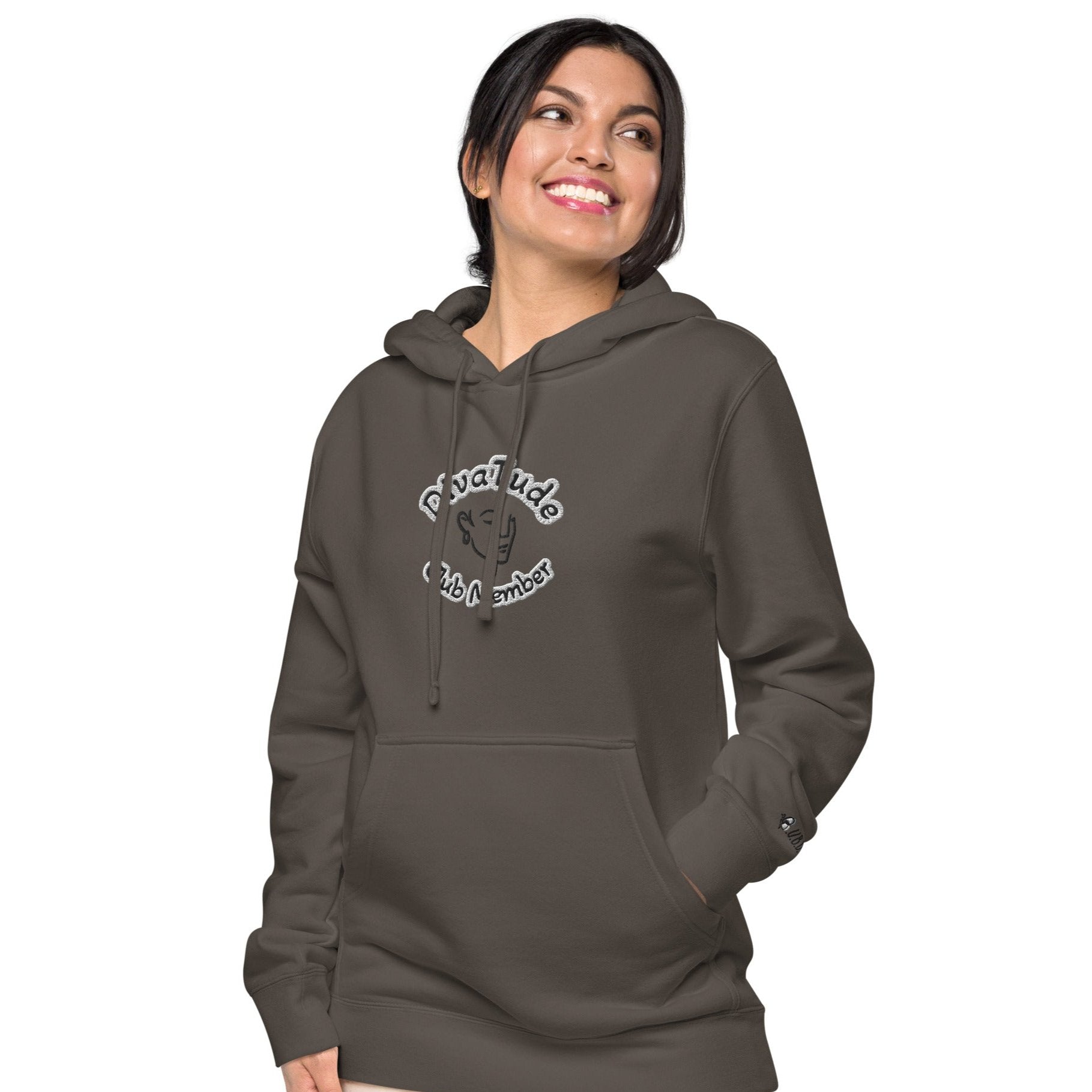 Front of pigment black hoodie with embroidered image of woman's face and text reading 'DivaTude' above and 'Club Member