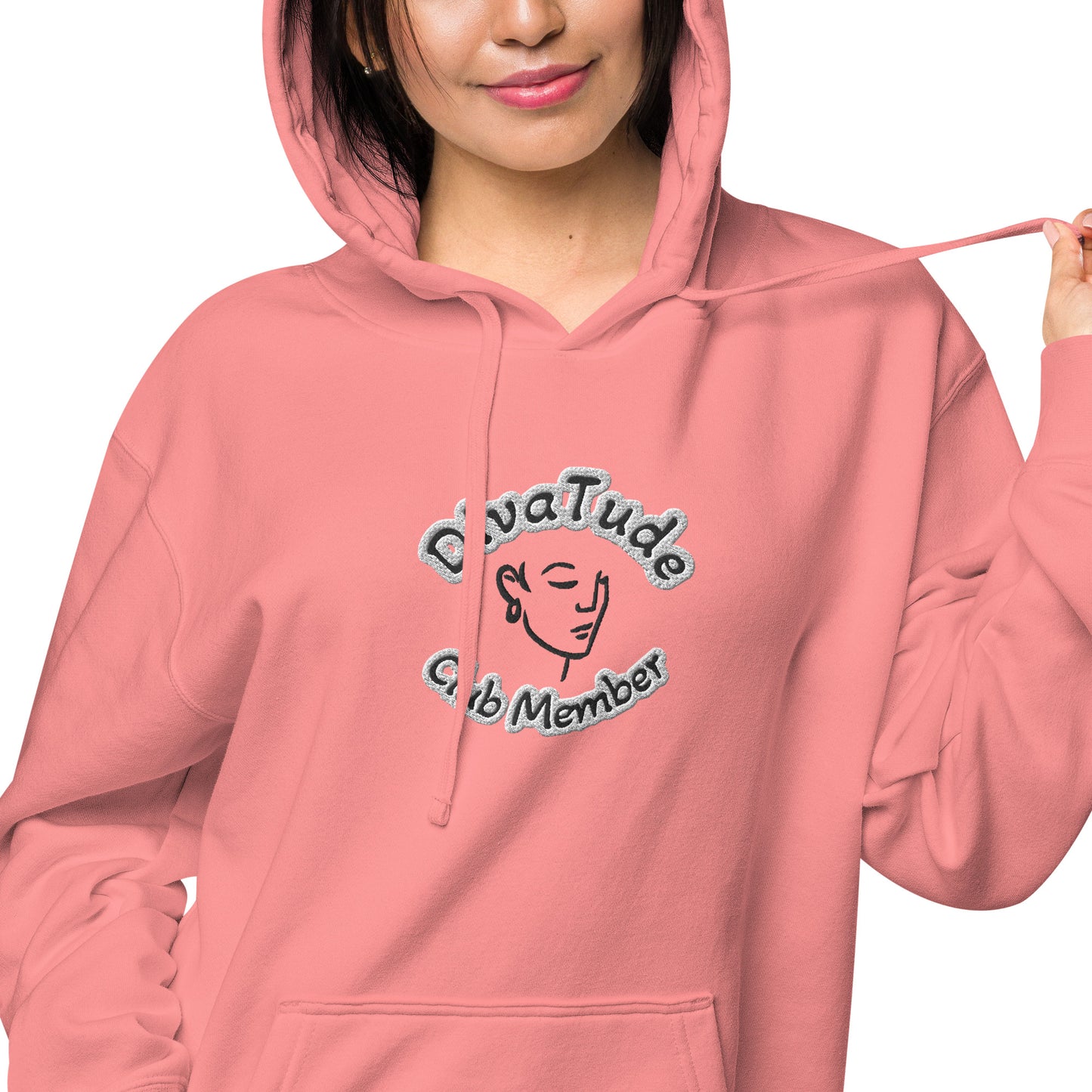 Front of pink hoodie with embroidered image of woman's face and text reading 'DivaTude' above and 'Club Member'