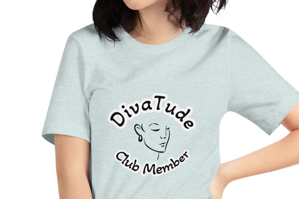 Front of ice blue women's tshirt with image of lady's face in black with white and black text saying "DivaTude' above and 'Club Member' below 