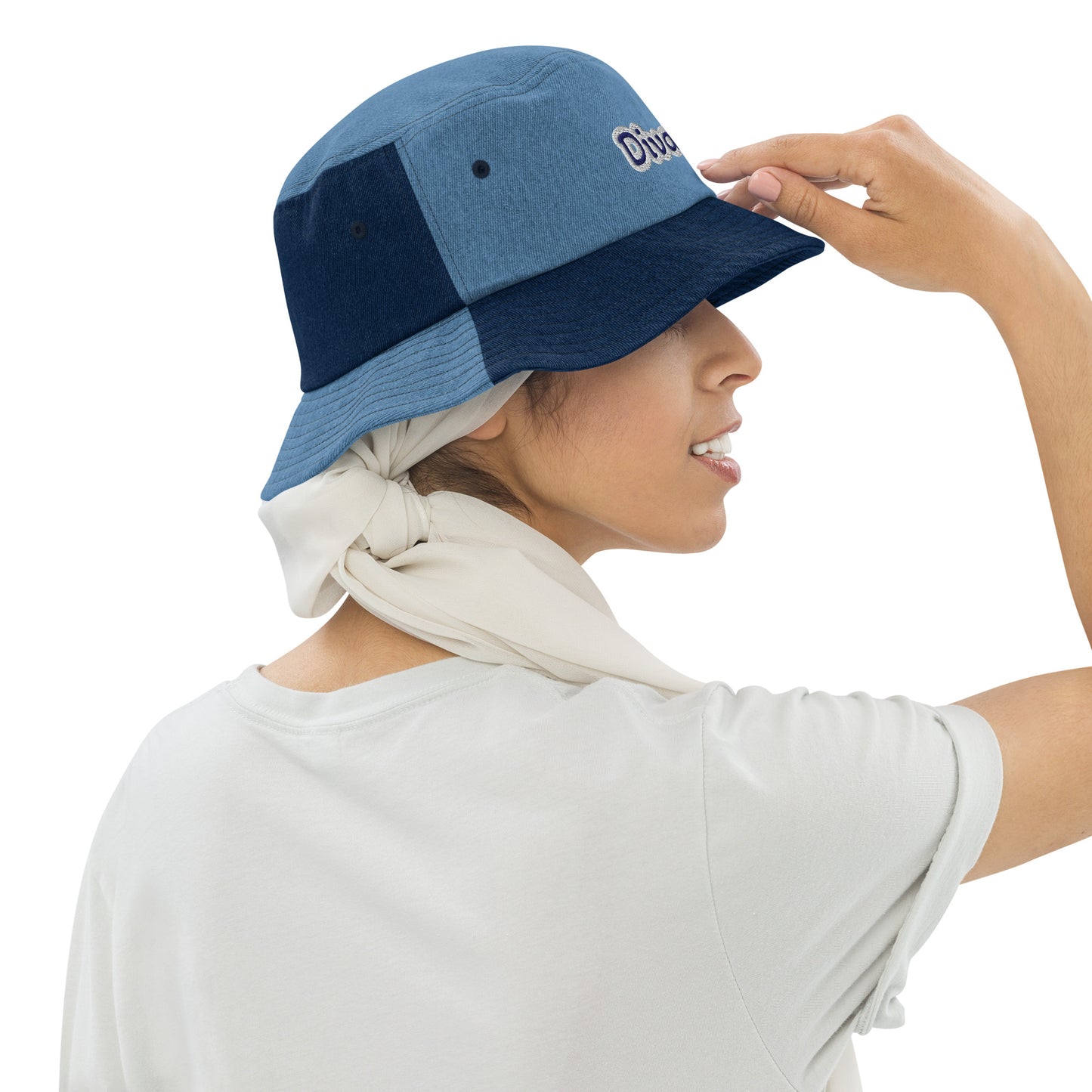 Right of two-tone denim bucket hat with embroidered navy and gray text saying 'DivaTude' across front