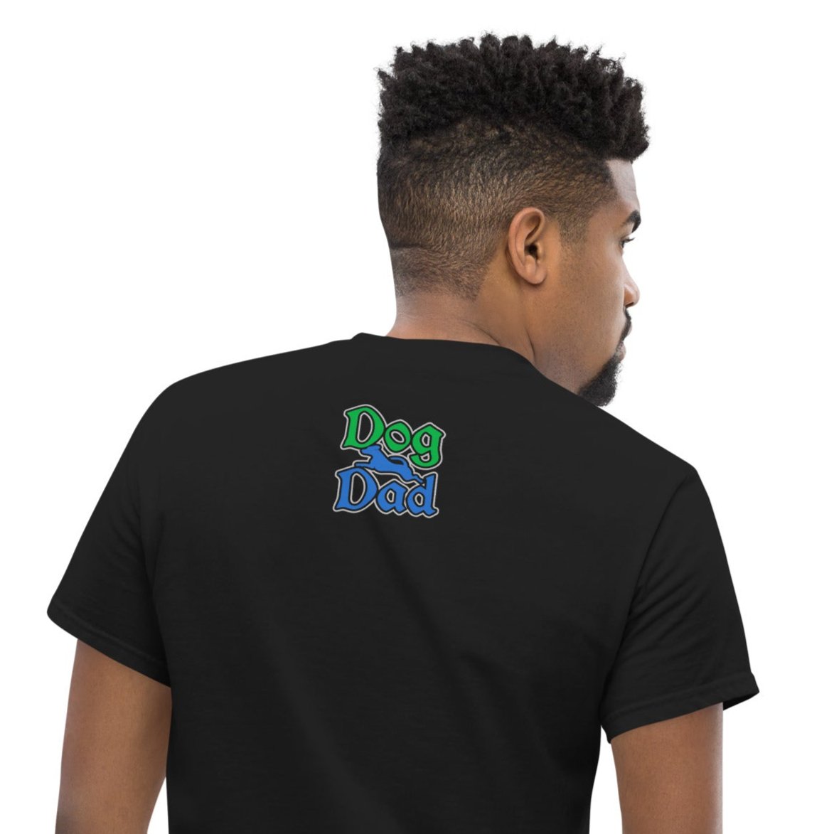 Back of black t-shirt with green and blue text saying 'Dog Dad'