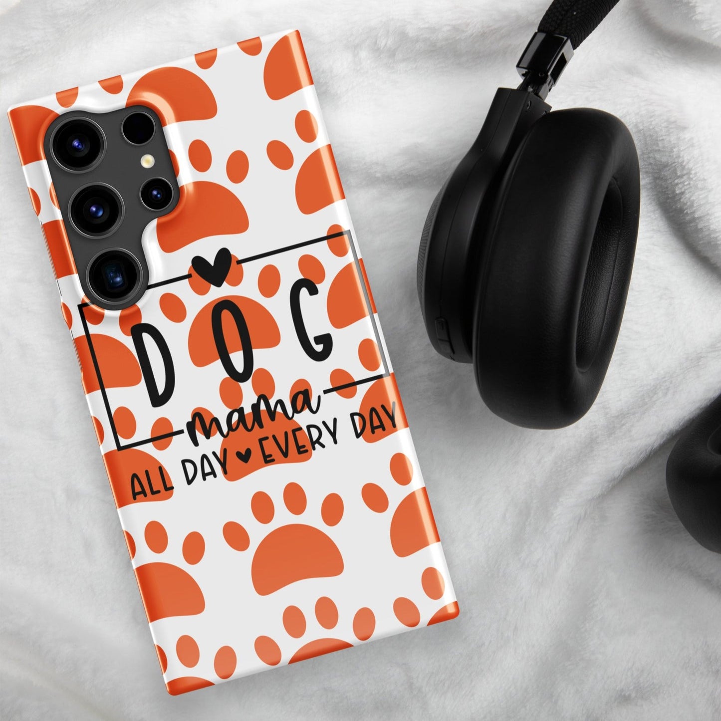 Front of Samsung snap case with a white and orange paw background and black text saying 'Dog Mama All Day Every Day'