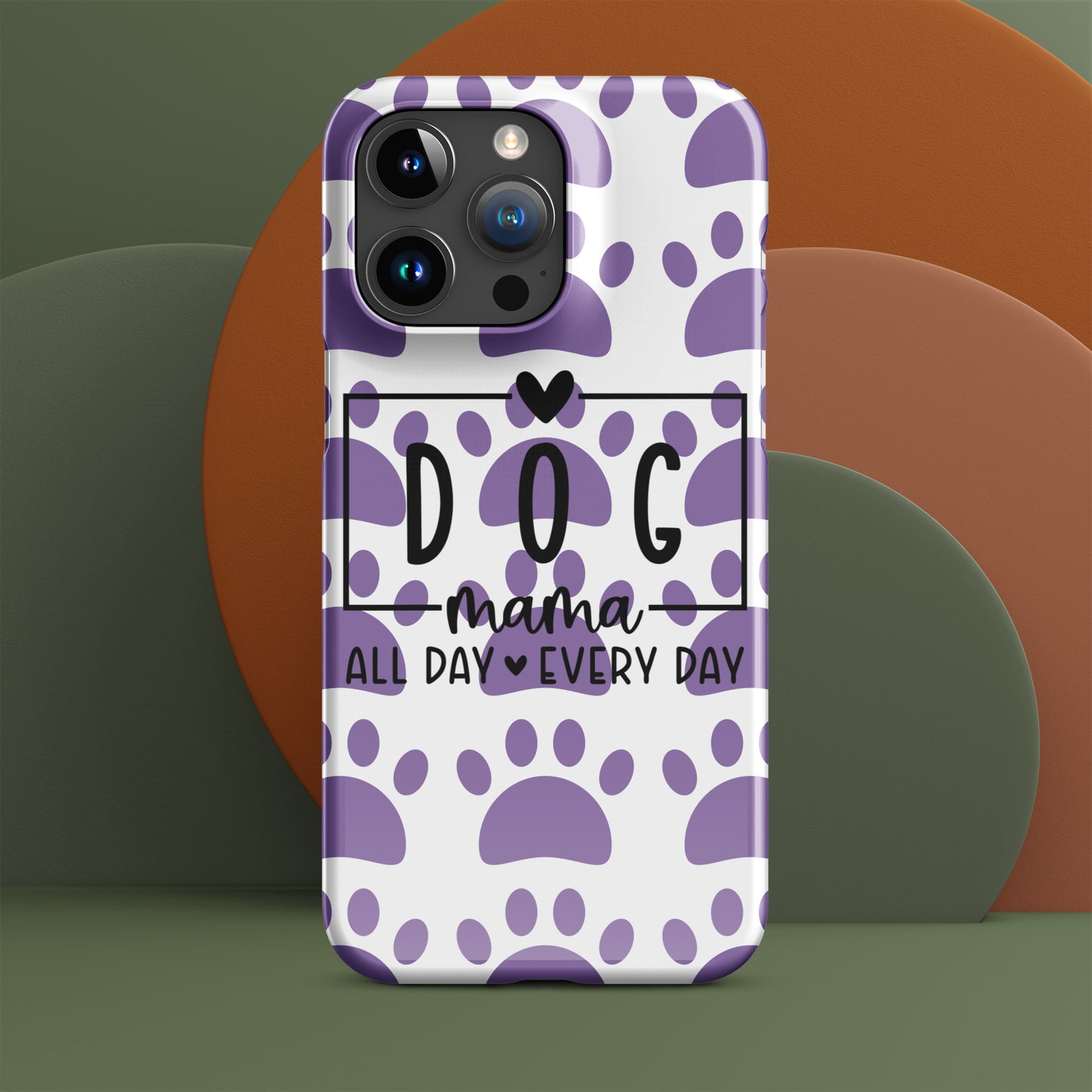 Front of iPhone snap case with a white and purple paw background and black text saying 'Dog Mama All Day Every Day'