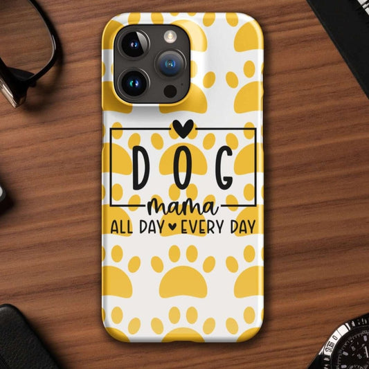 Front of iPhone snap case with a white and yellow paw background and black text saying 'Dog Mama All Day Every Day'